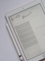 flat lay photography of turned-on silver iPad beside Apple Pencil