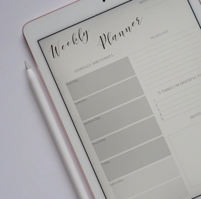flat lay photography of turned-on silver iPad beside Apple Pencil
