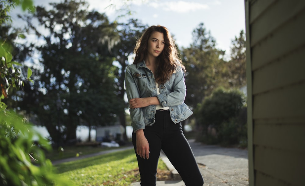 woman holding her arm near road