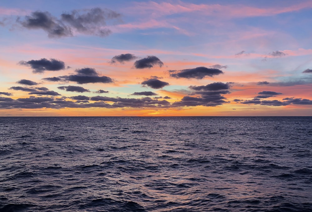 body of water during golden hour+