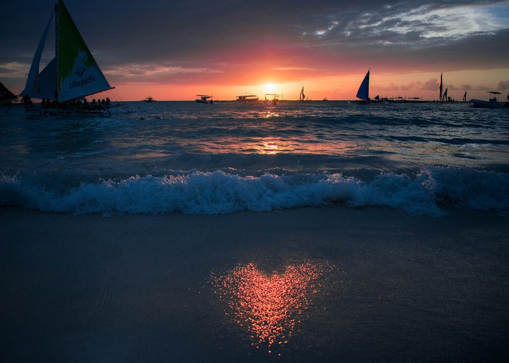 photography of waving water during sunset