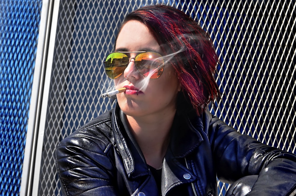 woman sitting while smoking