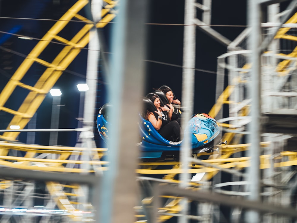 man and woman on roller coaster