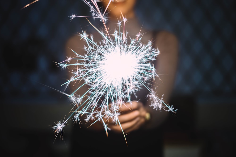 person holding sparkler,happy new year image,