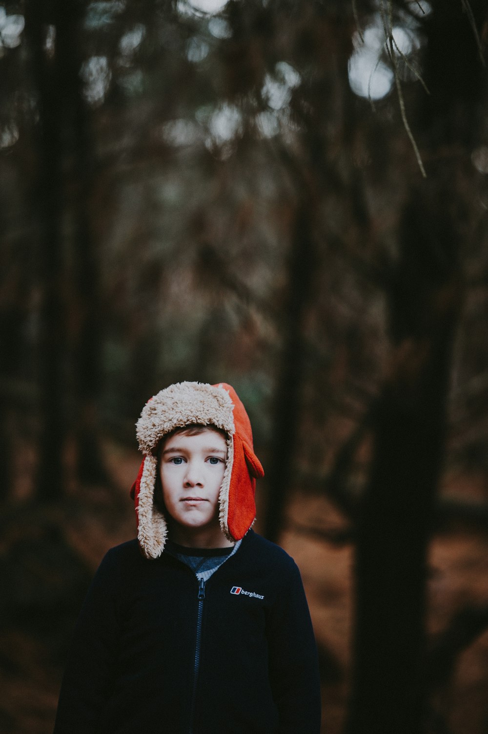 boy wearing red ear pluff