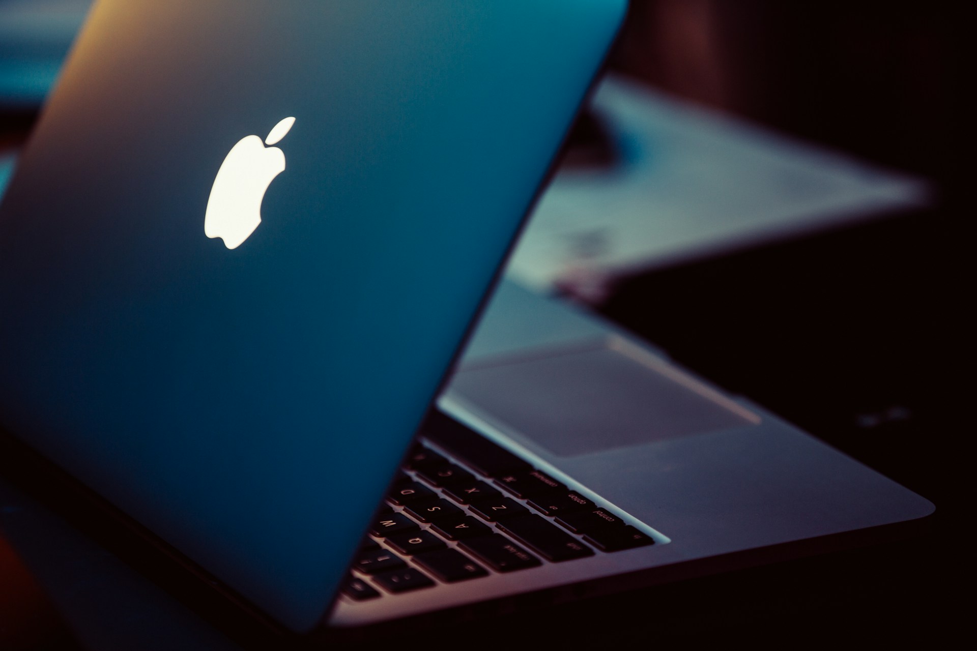 MacBook Pro on black surface