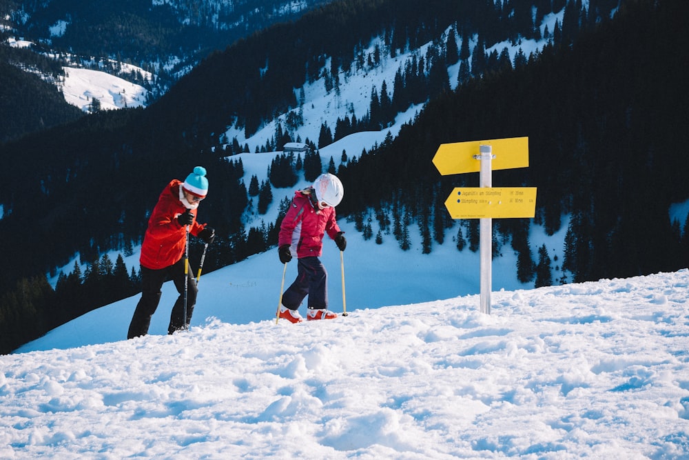 two person playing snow skis