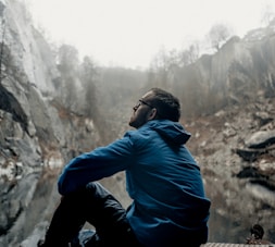 man sitting while looking up