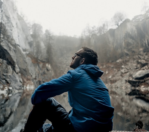 man sitting while looking up