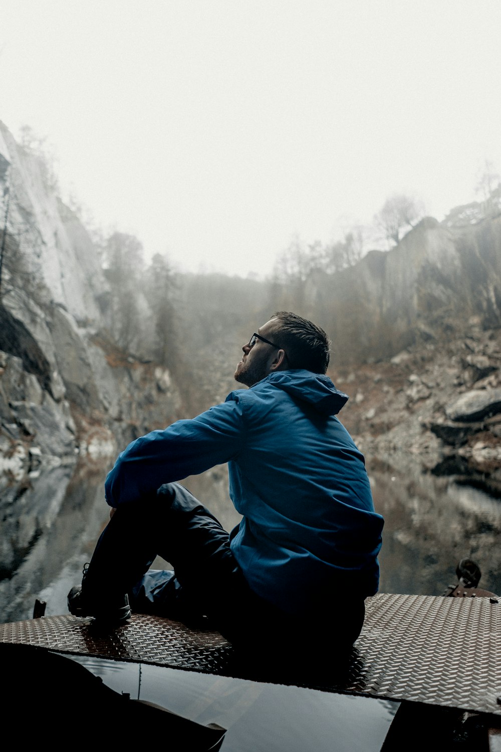 man sitting while looking up