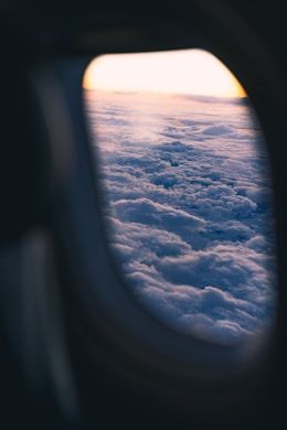 View of clouds from an airplane window during flight