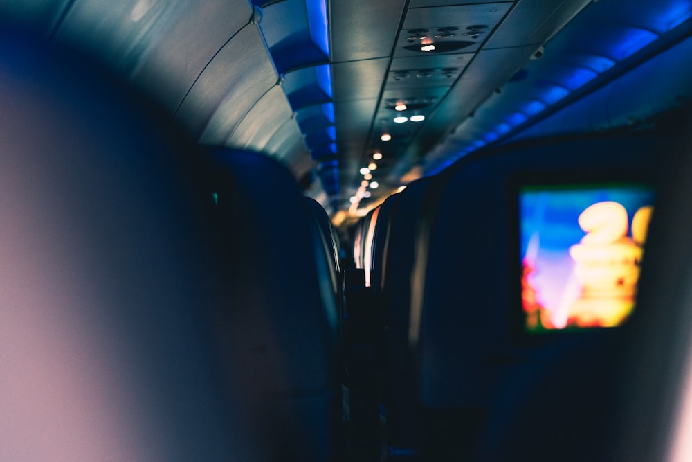 a view of the inside of an airplane with a television