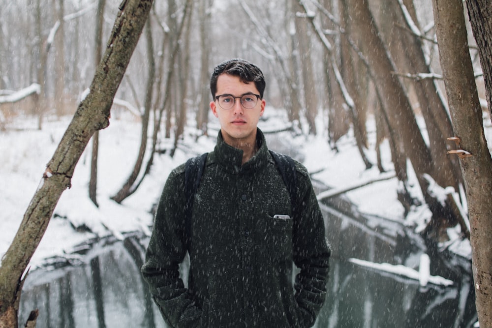 man standing on snow field