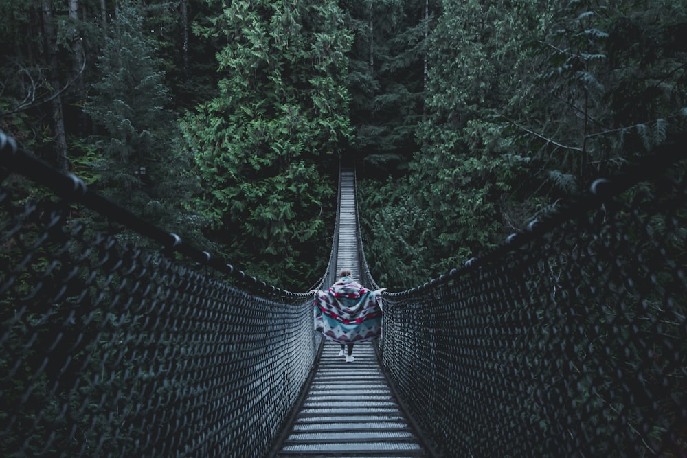 person crossing on the bridge