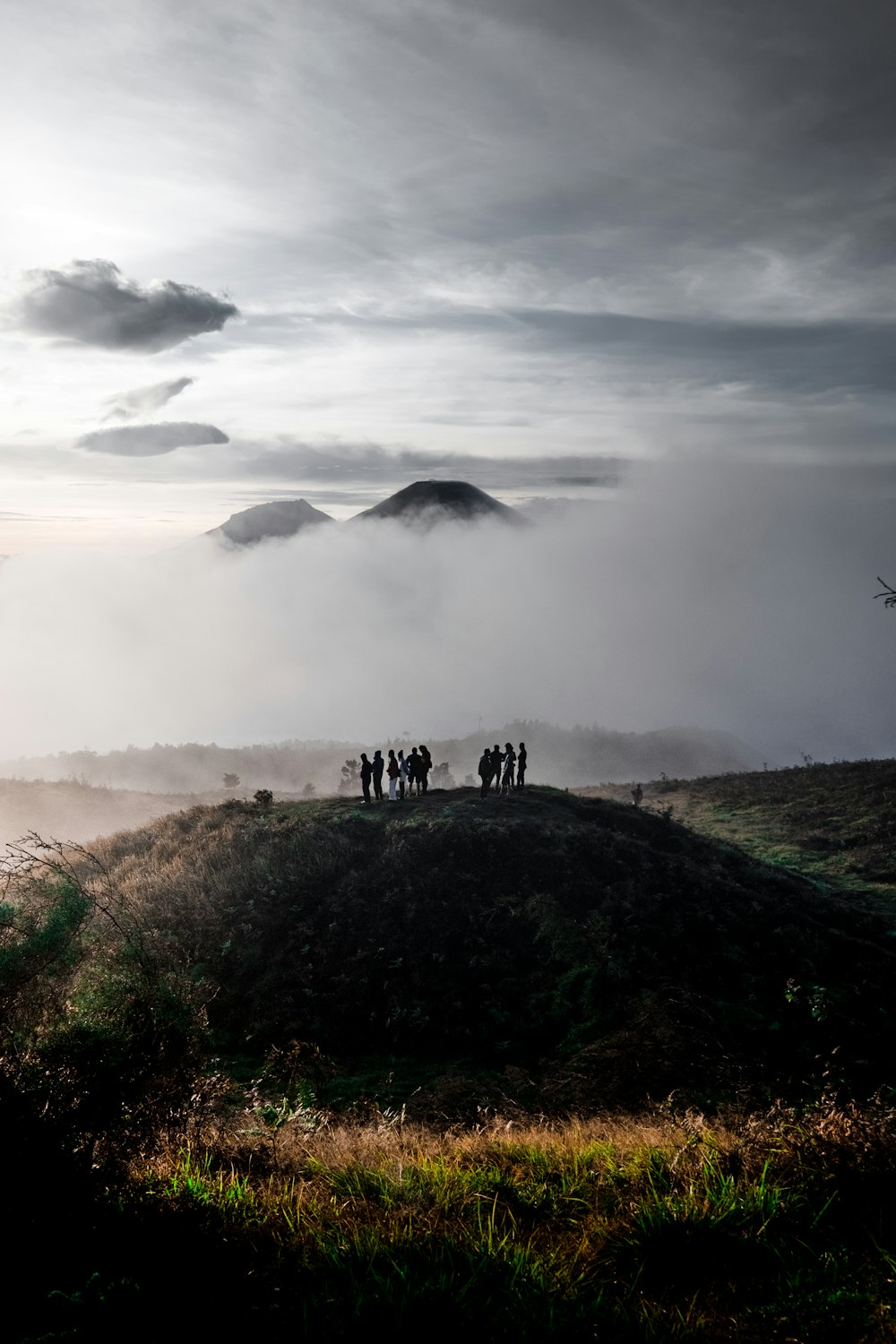 people standing on top of mountain