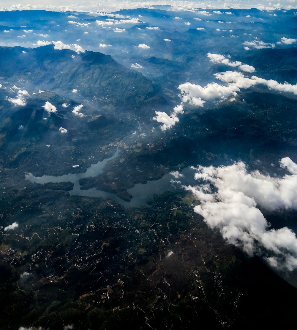 mountain ranges underneath white clouds