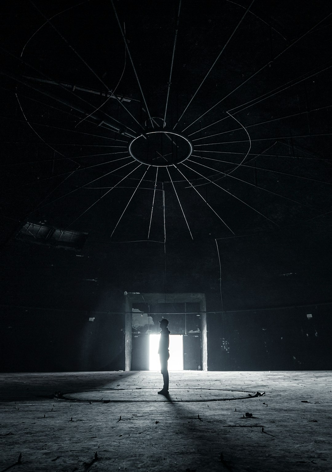 man standing inside dark building