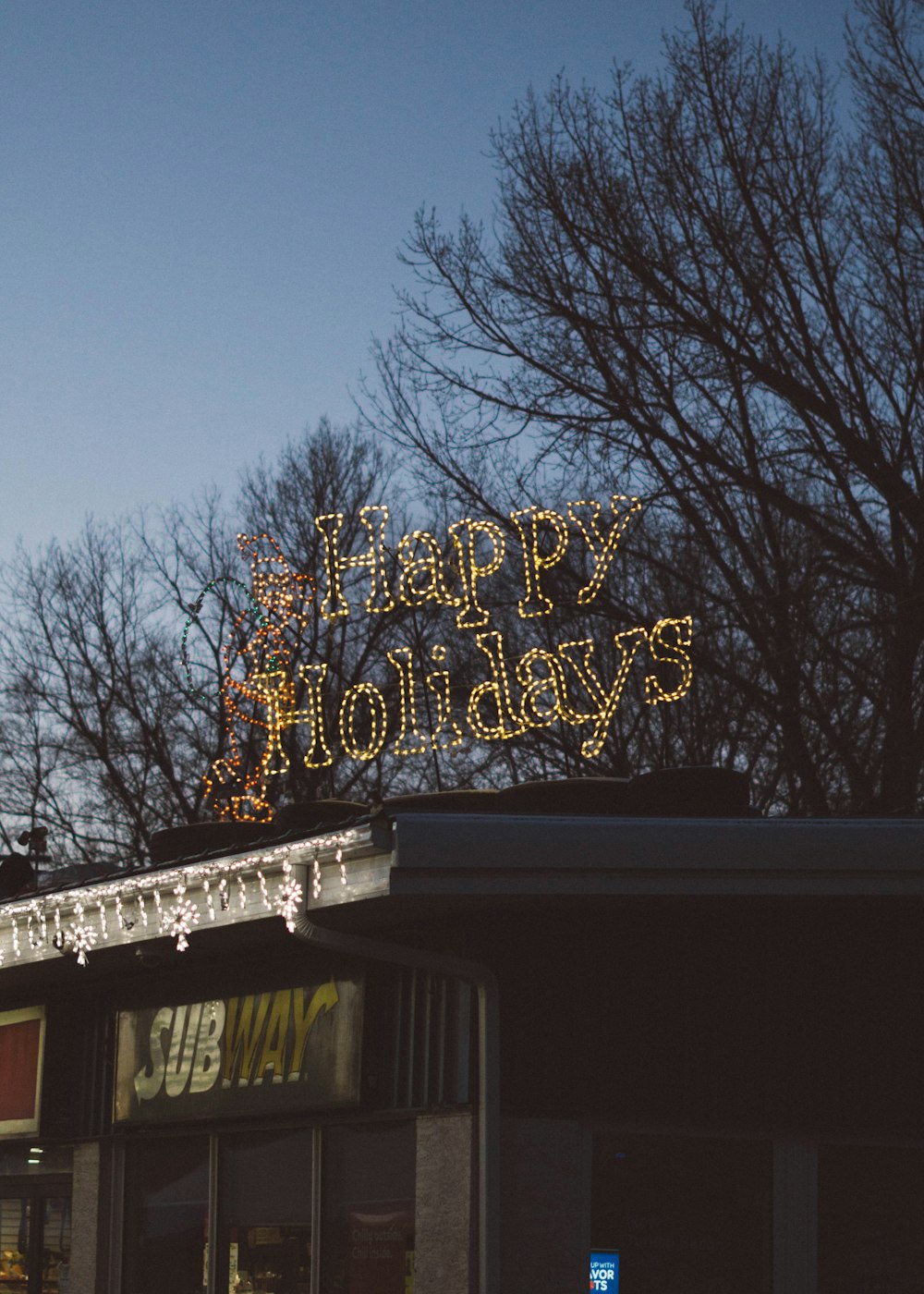 Happy Holidays LED signage during daytime