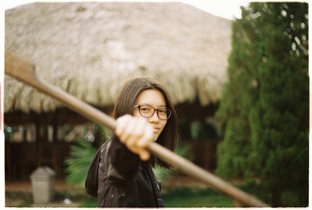 woman holding boat paddle