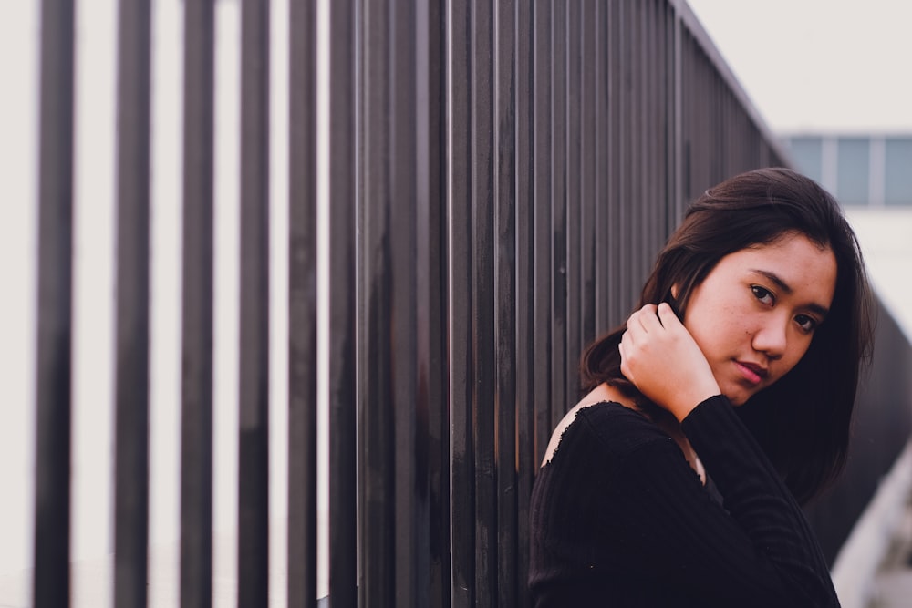 woman leaning on the rail