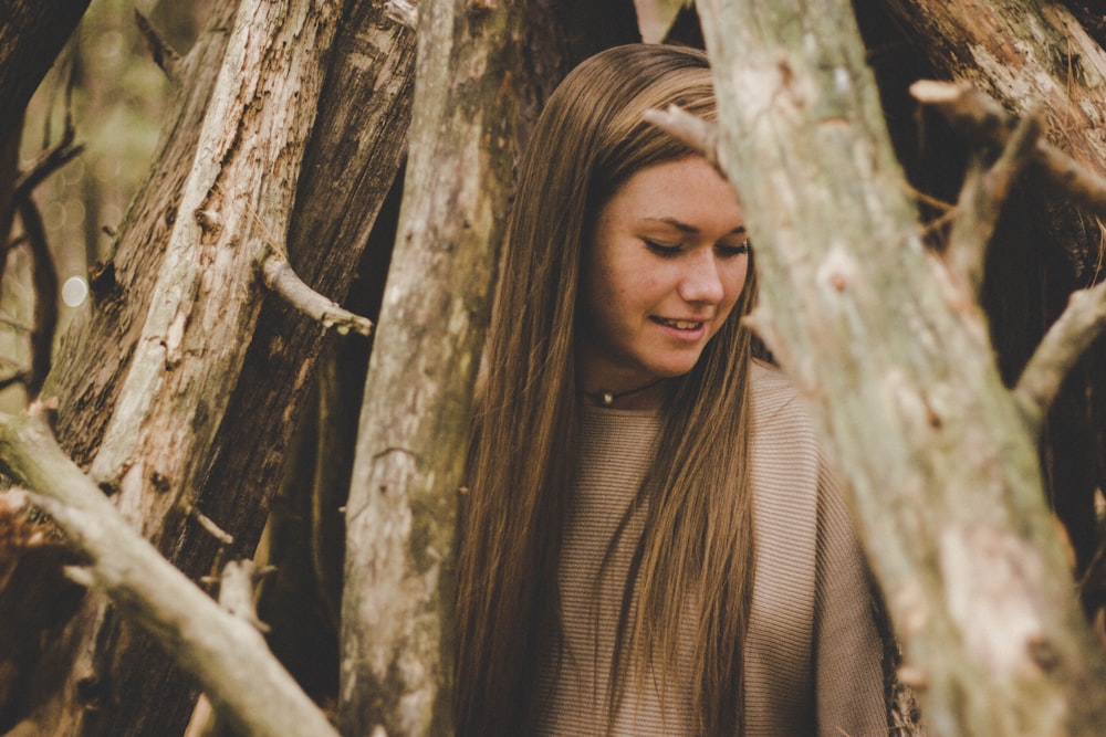 woman inside trees