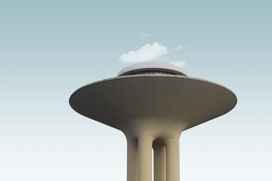 a very tall building with a sky in the background, Minimal UFO