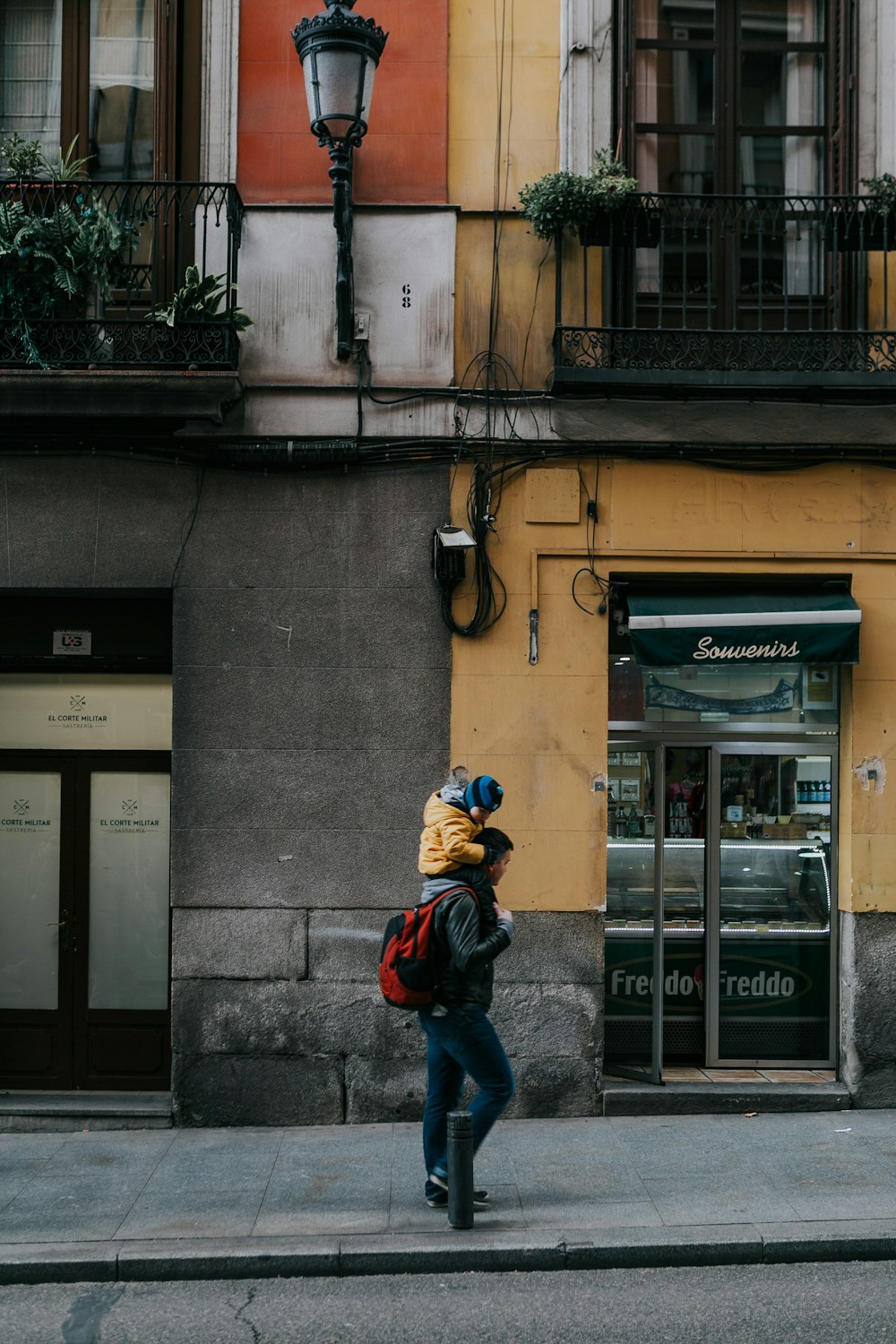 a person walking down a street with a backpack