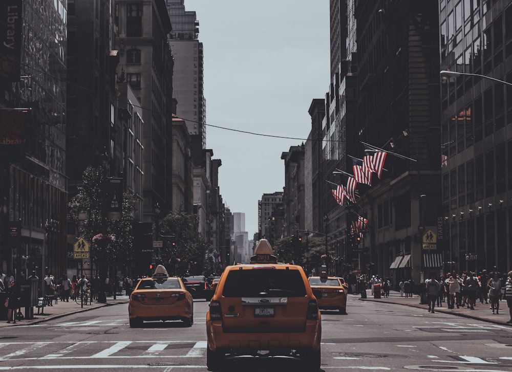 orange vehicle passing on road