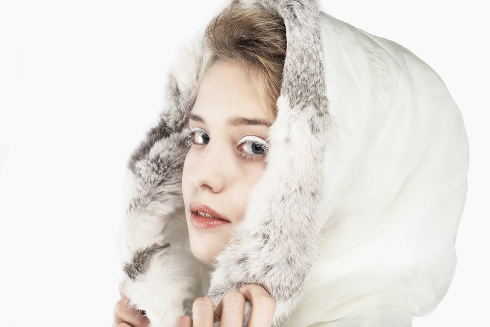 woman wearing white hoodie posing