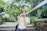 woman in white T-shirt using camera