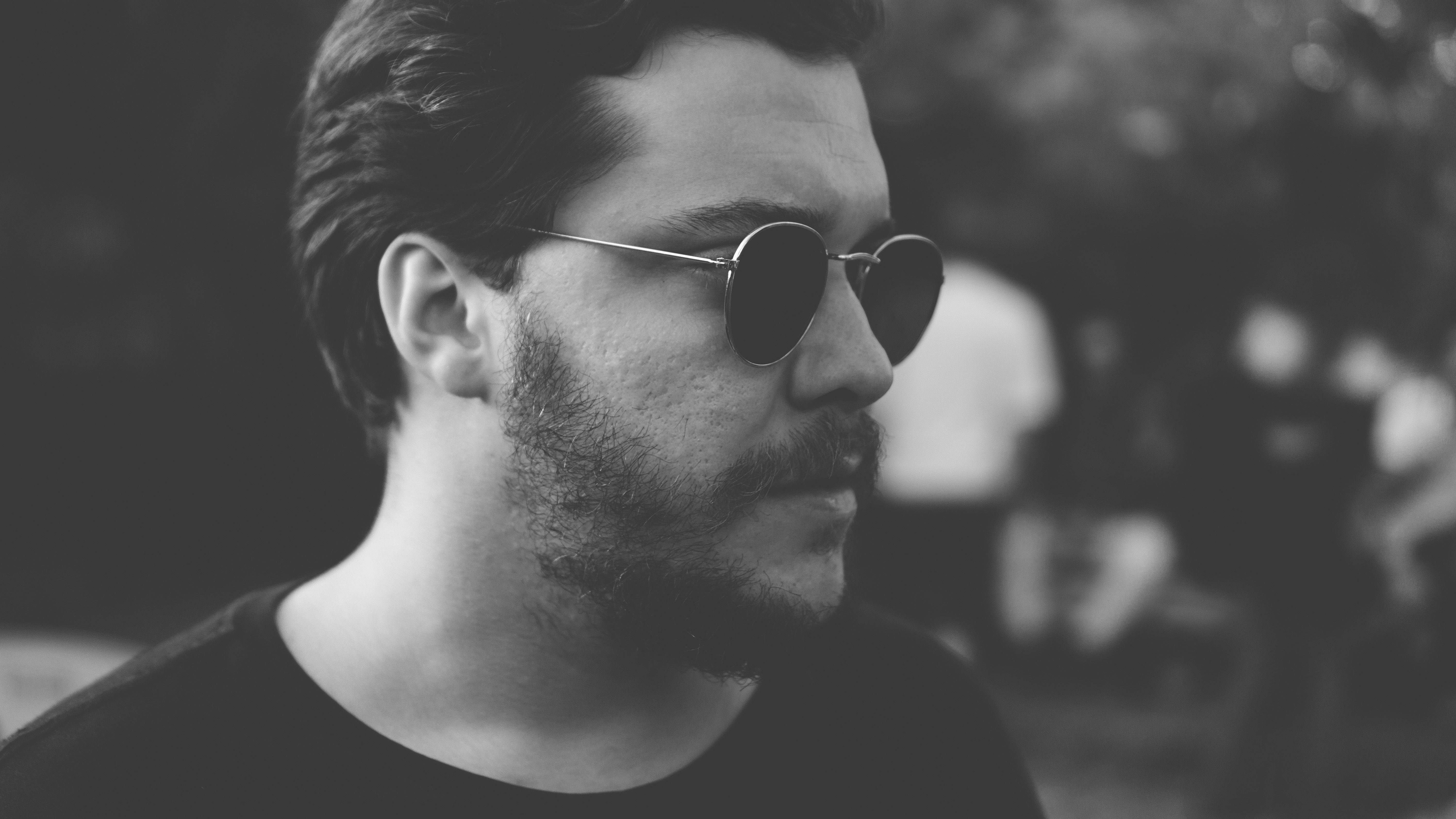 grayscale photography of man wearing sunglasses