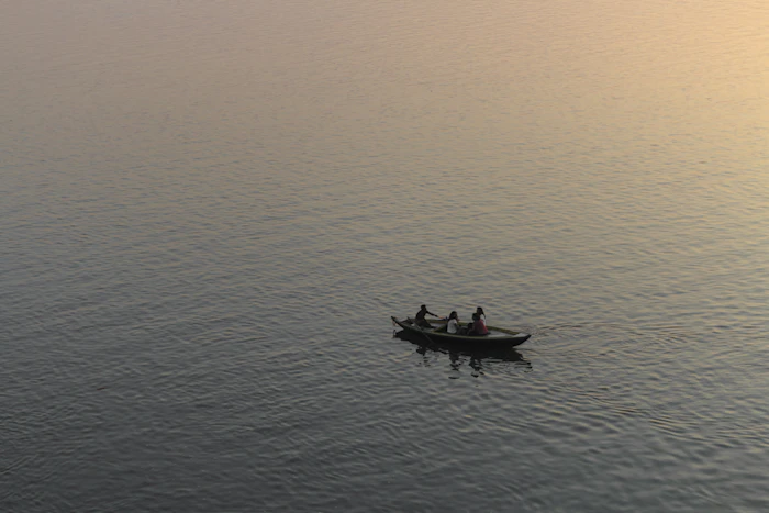 Rowing boat on the Ganges at sunrise in Varanasi