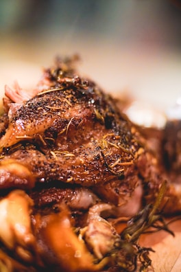 A close-up of a perfectly grilled steak with herbs.