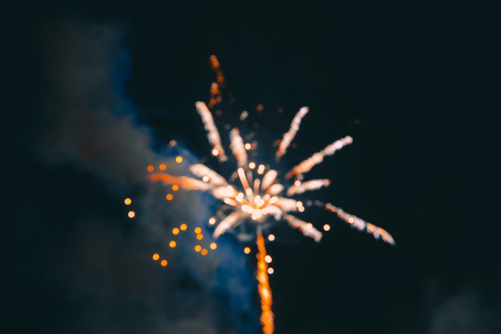 fireworks under cloudy sky