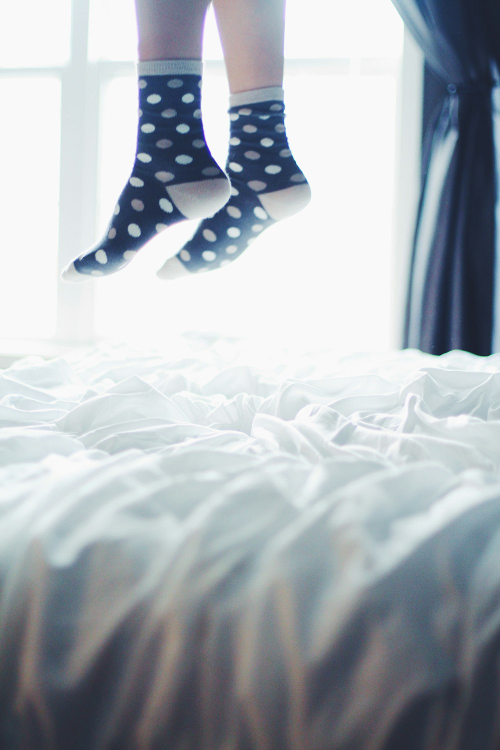 pair of white-and-black polka-dot socks