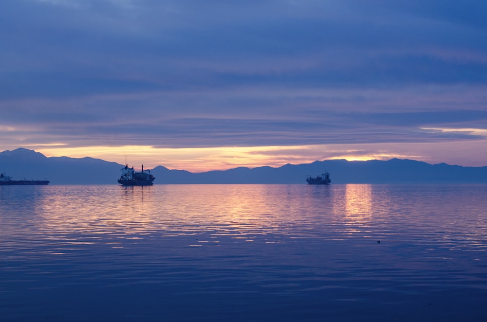 ship on body of water during golden hour