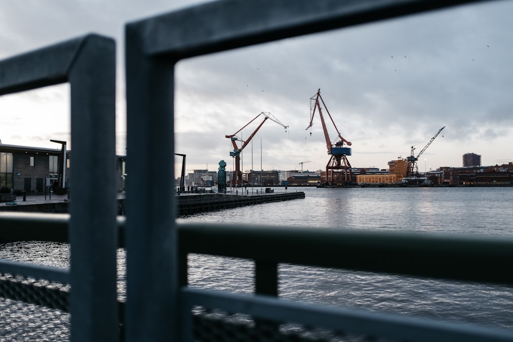 heavy equipment near buildings viewing sea