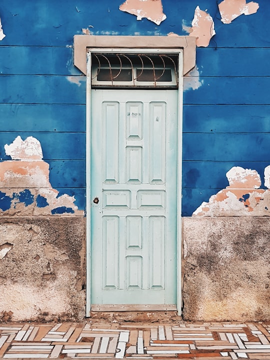 photo of building with white wooden door in Santa Maria Cape Verde