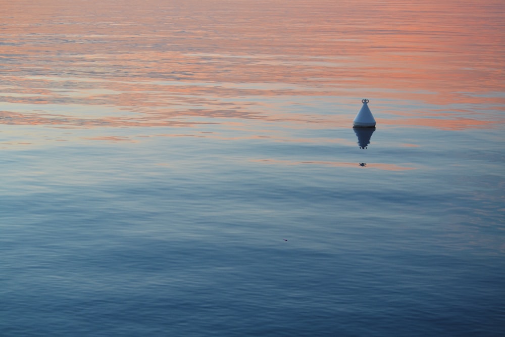 triangular metal floating in water