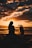 silhouette photo of woman and girl on shoreline
