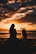 silhouette photo of woman and girl on shoreline