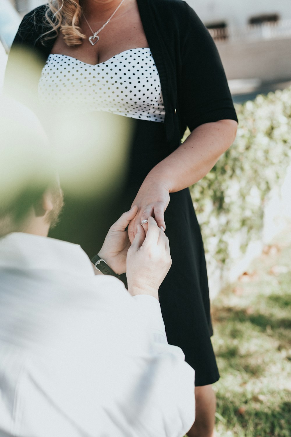 man proposing to woman during daytime