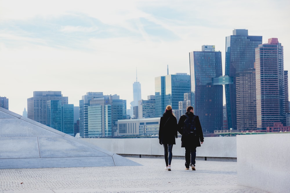 two people walking on rooftop