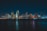 city near body of water during nighttime