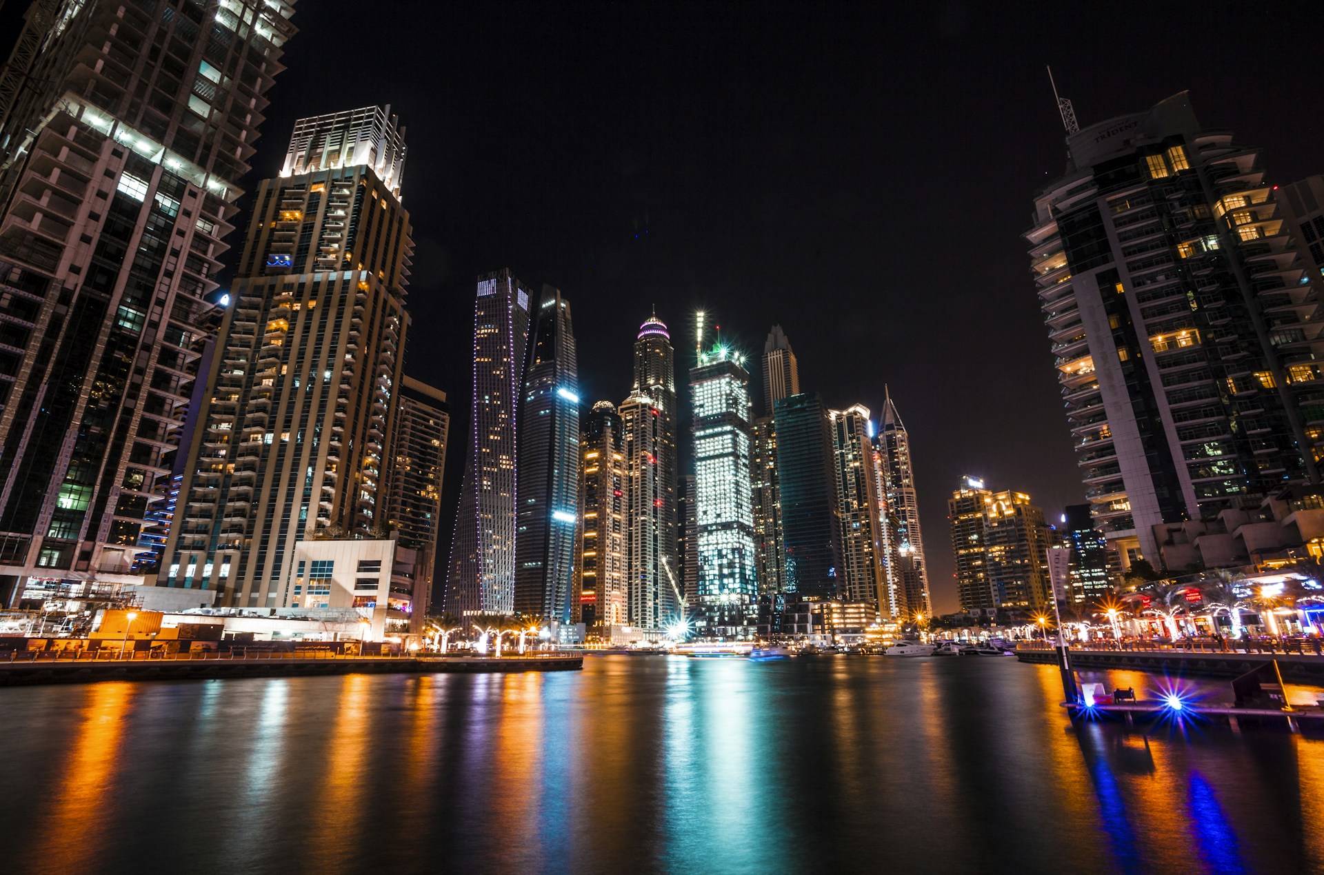 worm's eye view photography of city buildings at night