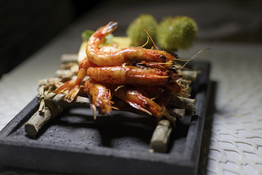 cooked prawns on bamboo stick