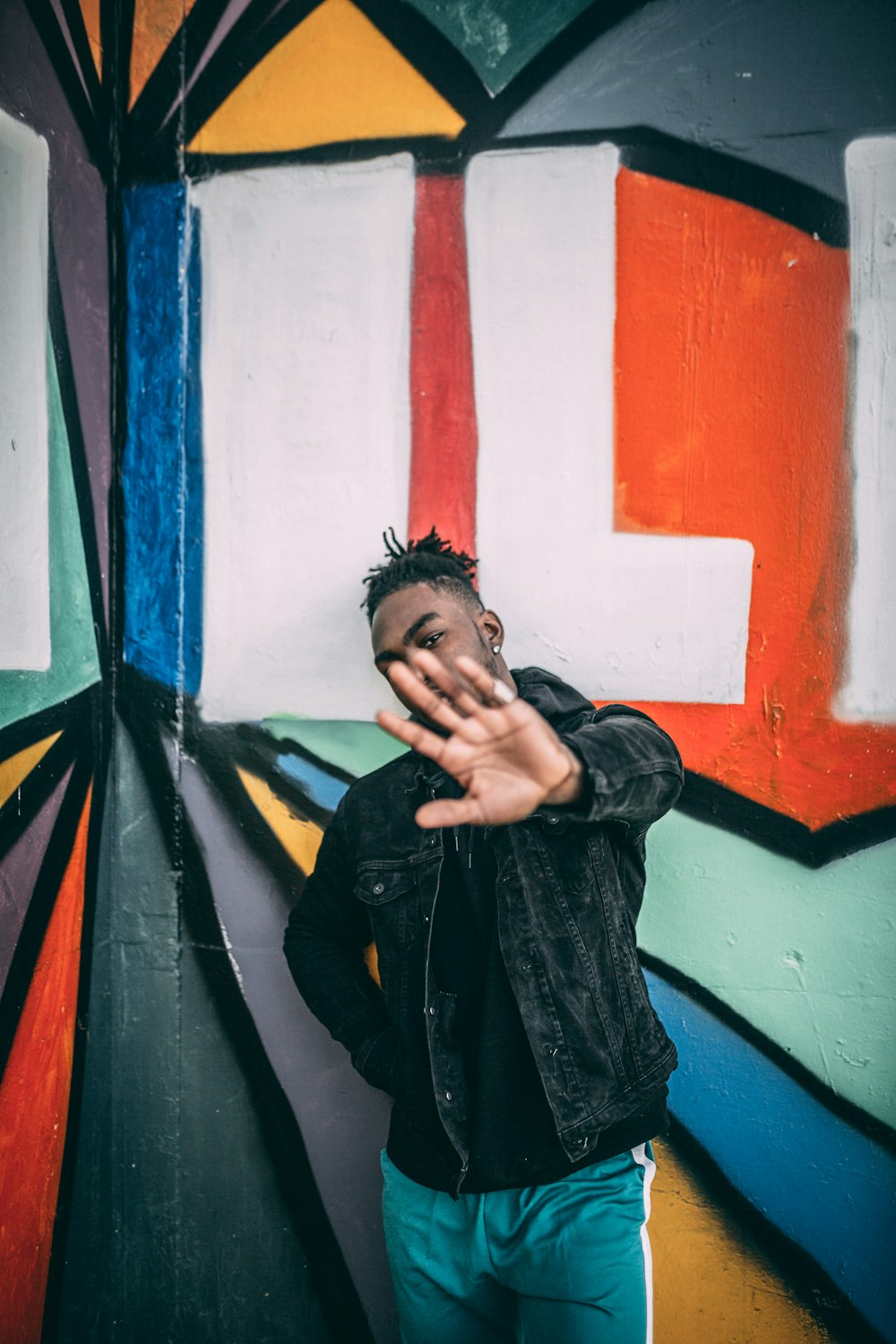 man wearing black denim jacket