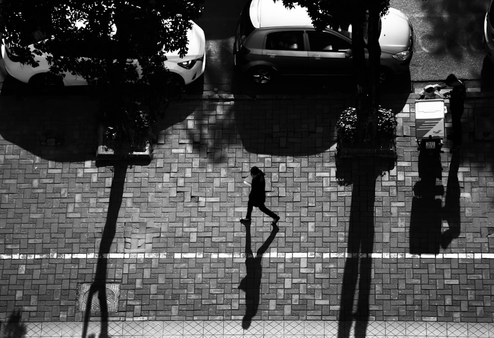 grayscale photo of cars on road