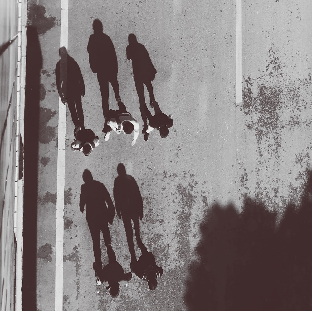 a black and white photo of a group of skateboarders