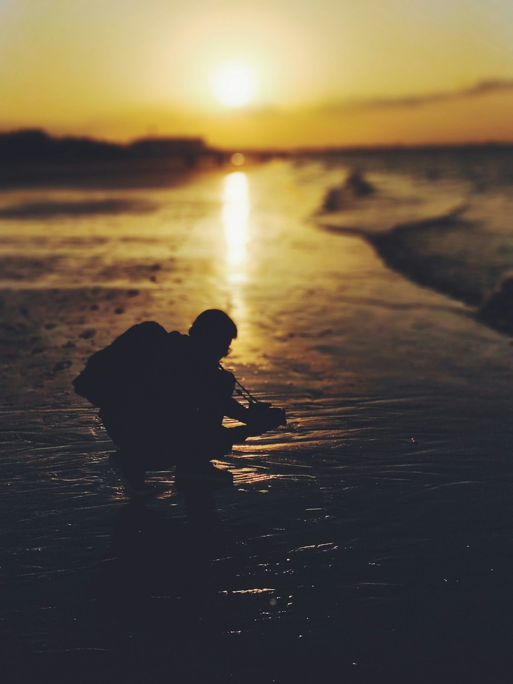 silhouette of person holding camera